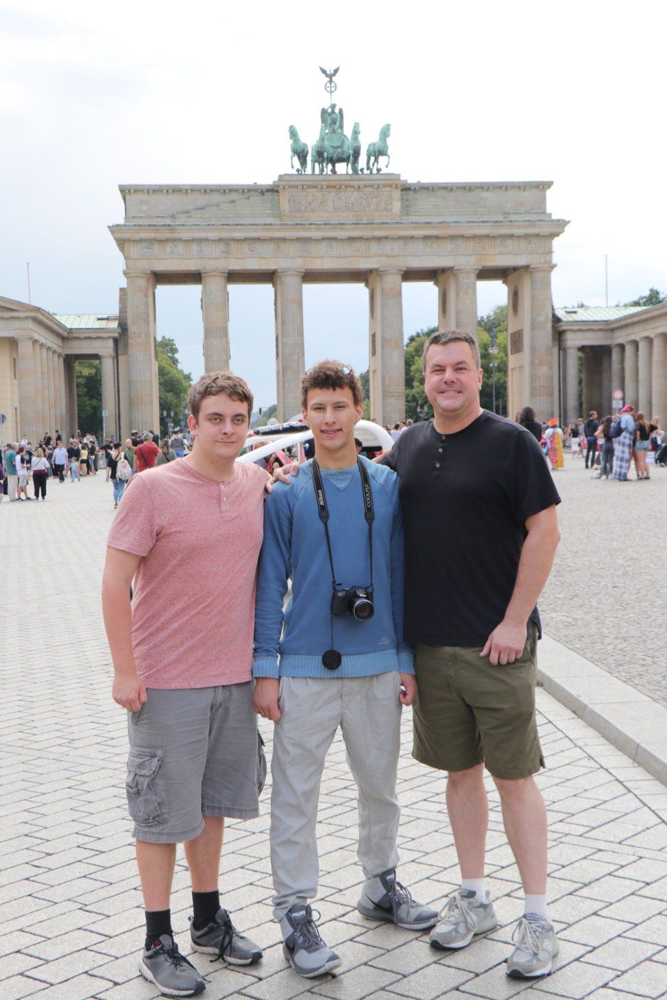 Roger and his sons at the Brandenburg Gate in Berlin