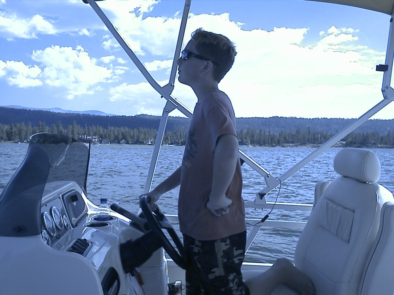 One of Roger's sons at the wheel of a boat on Big Bear Lake