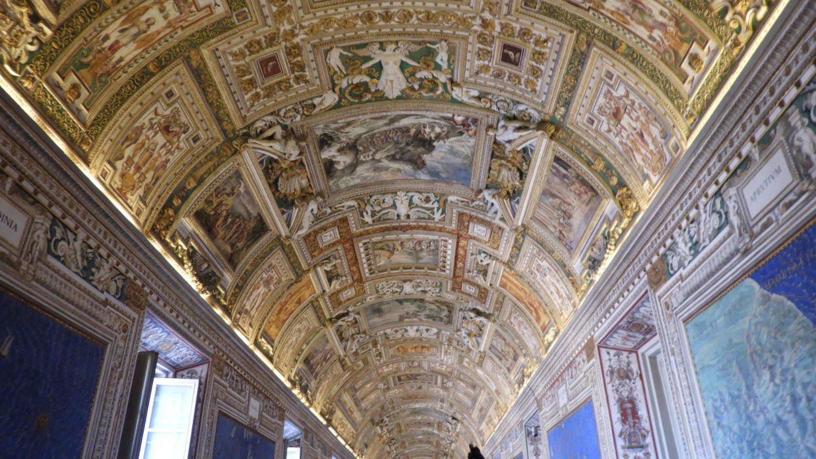 Ornate painted ceiling in a Vatican museum corridor